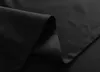 A close-up shot of black fabric, showing folds and stitching. Produktbild-Vorschau