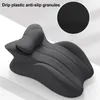A dark gray, ergonomically shaped cushion with a textured inset showing anti-slip granules. Produktbild-Vorschau