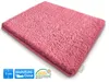 A pink bath mat is shown from a diagonal angle on a white background. Náhled obrázku produktu