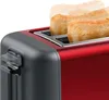 Close-up of a red and gray toaster with toast popping up. Voir les images du produit