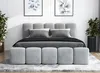 A modern bedroom setting with a bed, pillows, and decorative plants. Produktbild-Vorschau