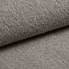 A close-up view of a textured beige fabric, likely bouclé, folded over itself. Produktbild-Vorschau