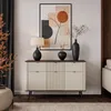 A modern living room with a sideboard, artwork, and decor. Produktbild-Vorschau