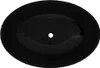 A top-down view of a black oval sink with a drain hole in the center. Náhľad obrázku produktu