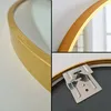 Collage of close-up shots of a round mirror with a gold frame, showing the frame detail and the mounting hardware. Produktbild-Vorschau