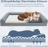 A dog bed with a puppy sleeping on it, and a diagram illustrating its features. Voir les images du produit