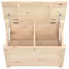 The image shows the interior of a wooden chest with its lid open, revealing two compartments and gas struts for support. Podgląd zdjęcia produktu