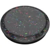 A close-up, top-down view of a black PopSocket with iridescent confetti-like flecks embedded in it. Podgląd zdjęcia produktu