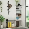 A hallway or entryway with a shoe cabinet, coat rack, and plant. Produktbild-Vorschau