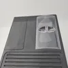 A close-up view of the top of a black coffee machine. Produktbild-Vorschau