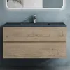 A bathroom vanity with a sink and faucet against a blue wall. Voir les images du produit