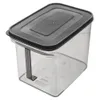A clear studio shot of a transparent food storage container with a black lid and handle. Produktbild-Vorschau
