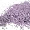 A pile of purple sprinkles on a white background. Voir les images du produit