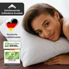 A woman is lying on a pillow, with marketing graphics overlaid on the left side of the image. Produktbild-Vorschau