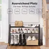 A multi-tiered shoe rack filled with various shoes and a handbag, placed indoors near a staircase. Produktbild-Vorschau
