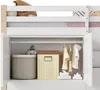Interior view of a child's loft bed storage unit, showing open cabinets with clothing and storage bins. Voir les images du produit