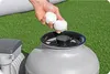 A person is adding filter balls to a pool filter system. Produktbild-Vorschau