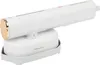 A white and gold handheld garment steamer on its charging base. Náhled obrázku produktu