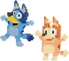 Two pixelated dog characters, Bluey and Bingo, made from beads, are shown against a white background. Produktbild-Vorschau