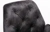 Close-up of the tufted backrest of a dark gray armchair. Produktbild-Vorschau