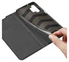 A hand is shown inserting a phone into a black flip case. Náhľad obrázku produktu