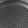 A close-up view of a black surface with a repeating white geometric pattern. Náhľad obrázku produktu