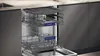 An open dishwasher with two racks pulled out, showing the interior. Produktbild-Vorschau