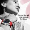 A person wearing a smartwatch with a red band. Podgląd zdjęcia produktu