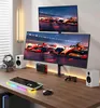 A gaming setup with dual monitors, keyboard, mouse, headphones, and speakers on a wooden desk. Náhľad obrázku produktu