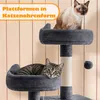 Two cats are on a multi-level cat tree. The cat tree has plush platforms and scratching posts. The background is a light-colored, textured wall. Produktbild-Vorschau
