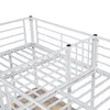 A close-up view of the white metal frame of a bunk bed, showing the slatted base and railing. Náhľad obrázku produktu