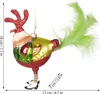 A glass Christmas ornament shaped like a rooster, with glitter accents and green feathers for a tail, is shown against a white background. Measurement indicators are present on the left and bottom right. Voir les images du produit