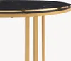 A close-up view of a modern coffee table with a black marble top and gold metal legs. Produktbild-Vorschau