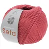 A ball of red yarn with a label. Produktbild-Vorschau