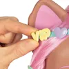 A hand is holding a small yellow letter 'V' from the word 'VIP' which is attached to a light blue collar with a purple heart charm. The collar is around the neck of a styling head with pink hair and pink cat ears. Podgląd zdjęcia produktu