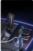 A close-up view of a car's center console, showing a gear shifter, a wireless charging pad, and a Carlinkit adapter plugged into a car charger. Produktbild-Vorschau