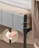 Close-up view of a bed frame with a focus on the side and legs. A hand is shown cleaning the leg. Náhled obrázku produktu