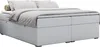 A white boxspring bed with a low headboard and storage drawers, shown from a side angle. Produktbild-Vorschau