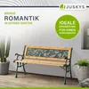 A garden bench is shown in an outdoor setting with plants and a wall. Náhled obrázku produktu