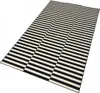 A rug with a black and white striped pattern, laid out on a white background. Anteprima dell’immagine prodotto