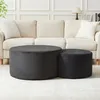 Two round ottomans are placed in front of a couch in a living room setting. Produktbild-Vorschau