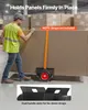 A worker in a warehouse is moving a large panel using a dolly. Podgląd zdjęcia produktu