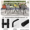 A balcony set with a table and two chairs, shown on a patio with plants and a railing. Voir les images du produit