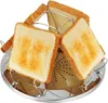 A toaster rack with four slices of toast on a white background. Produktbild-Vorschau