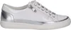 A white sneaker with silver accents is shown against a white background. Voir les images du produit