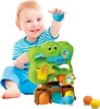 A baby is playing with a colorful toy ball drop. Produktbild-Vorschau