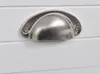 A close-up shot of a silver drawer pull on a white surface. Náhled obrázku produktu