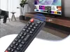 A remote control is shown in the foreground, with a television and living room furniture in the background. Náhled obrázku produktu