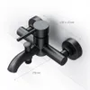A black bathroom faucet mounted on a white wall, with dimensions indicated by lines and text. Produktbild-Vorschau