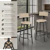 Two bar stools are shown in a modern kitchen setting, with descriptive text on the left side of the image. Náhled obrázku produktu